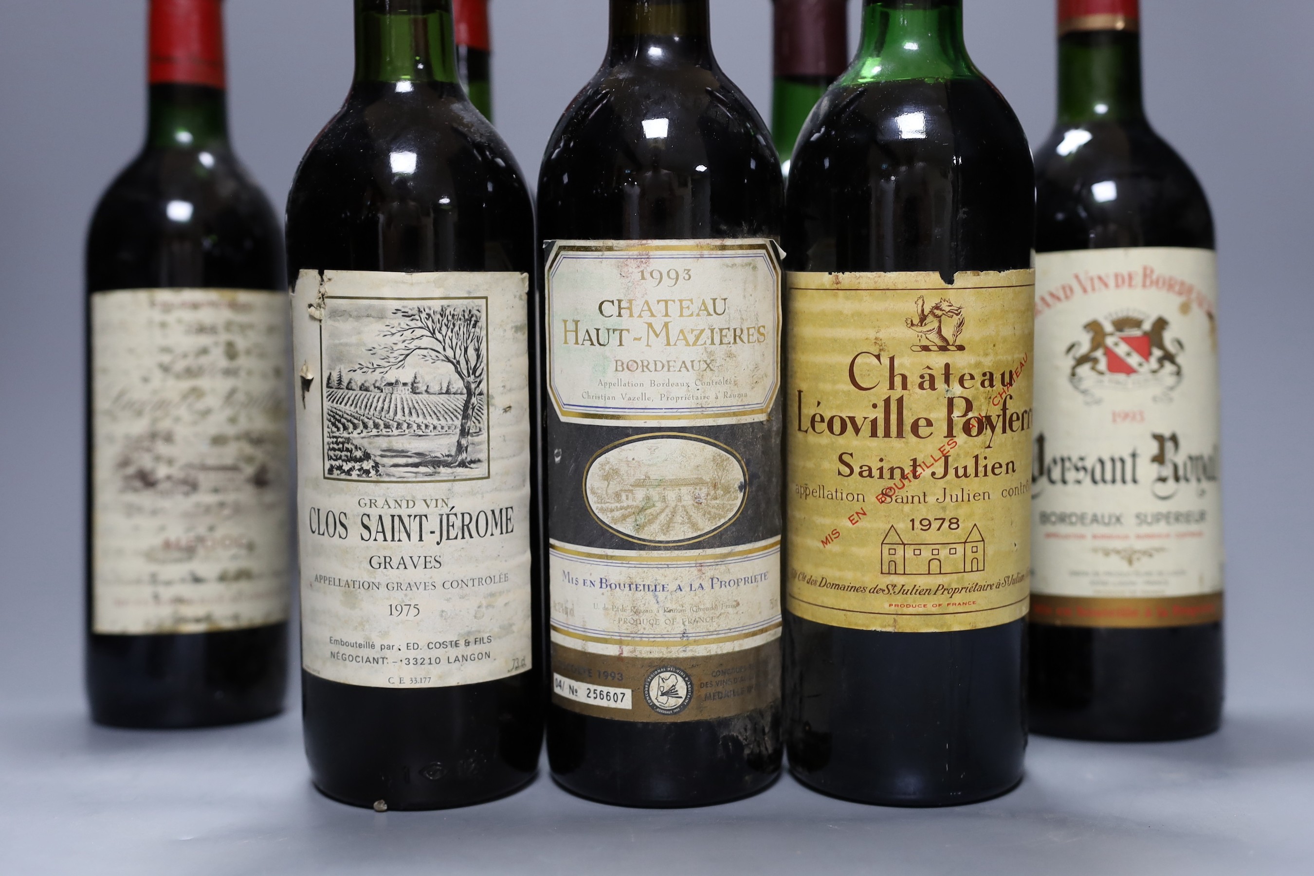 Ten bottles of various wine to include 1975 Clos Saint-Jerome, 1982 Baron Philippe Mouton Cadet, 1985 Chateau Lacombe-Noaillac and others